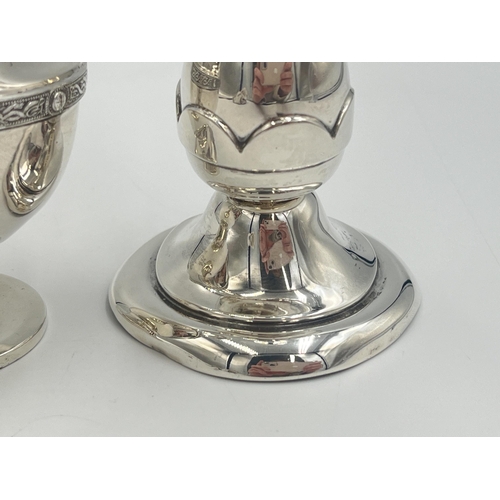 2101 - Two pieces of hallmarked Birmingham silver, one Bishton's Ltd. tulip vase, dated 1969 and one Duncan... 