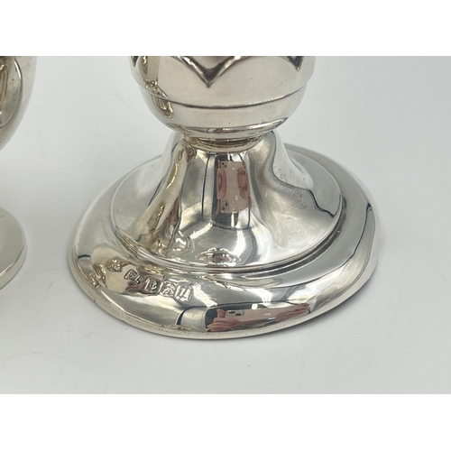 2101 - Two pieces of hallmarked Birmingham silver, one Bishton's Ltd. tulip vase, dated 1969 and one Duncan... 