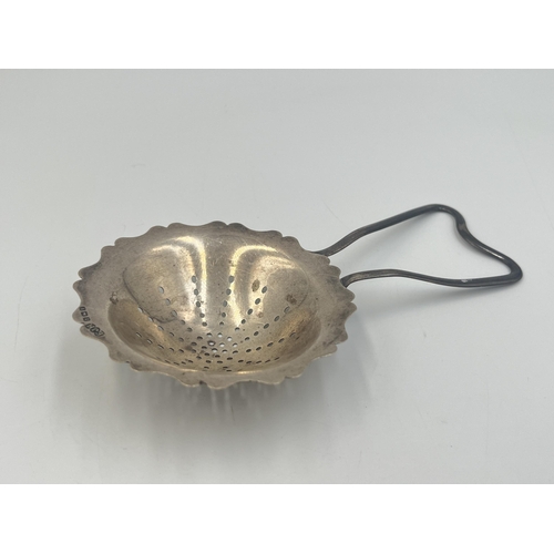 2106 - An Edwin Joseph Houlston hallmarked Birmingham silver tea strainer, dated 1920 - approx. gross weigh... 