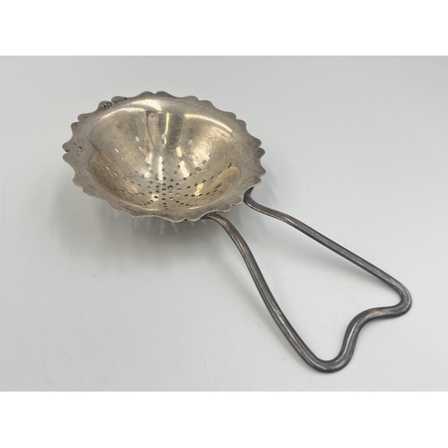 2106 - An Edwin Joseph Houlston hallmarked Birmingham silver tea strainer, dated 1920 - approx. gross weigh... 