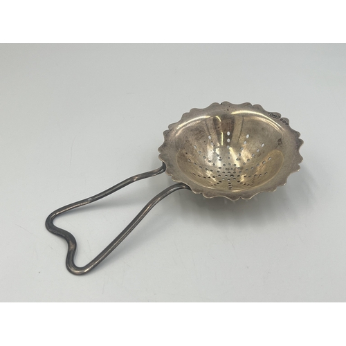 2106 - An Edwin Joseph Houlston hallmarked Birmingham silver tea strainer, dated 1920 - approx. gross weigh... 