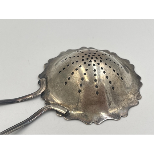 2106 - An Edwin Joseph Houlston hallmarked Birmingham silver tea strainer, dated 1920 - approx. gross weigh... 