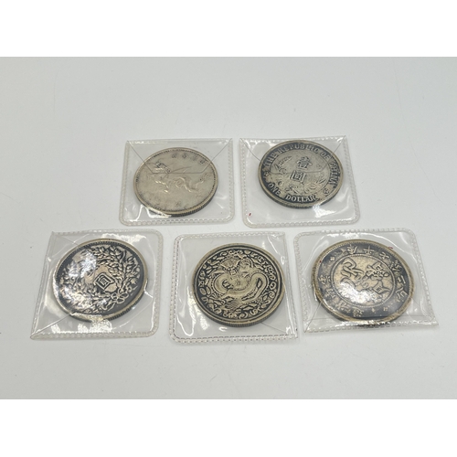 2108 - Five items, four silver plated replica Chinese coins and one token