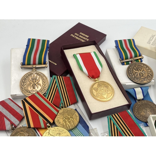 2157 - A collection of military and police medals to include Russian, Romanian Jubilee, Africa Service etc.