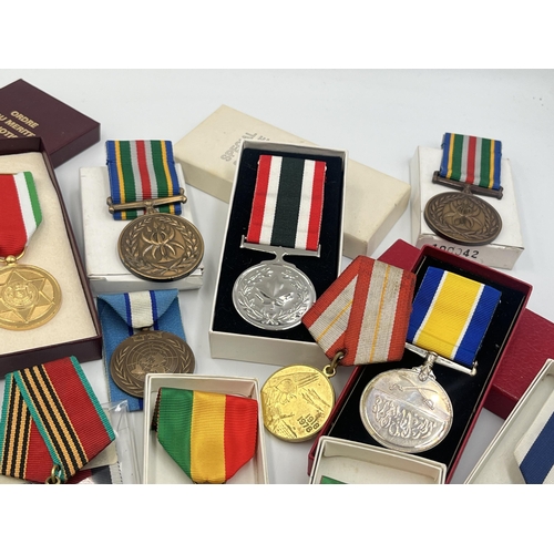 2157 - A collection of military and police medals to include Russian, Romanian Jubilee, Africa Service etc.