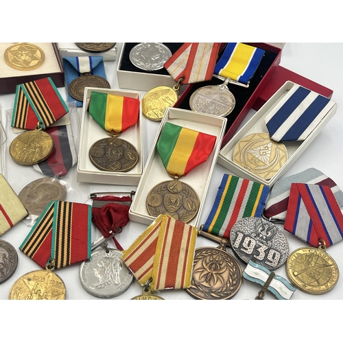 2157 - A collection of military and police medals to include Russian, Romanian Jubilee, Africa Service etc.