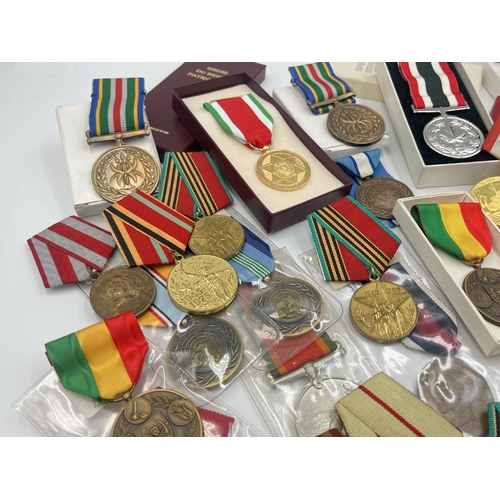 2157 - A collection of military and police medals to include Russian, Romanian Jubilee, Africa Service etc.