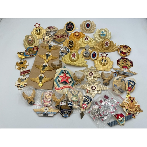 2170 - A collection of Russian badges and medals to include set of four Airbourne Troops qualification wing... 