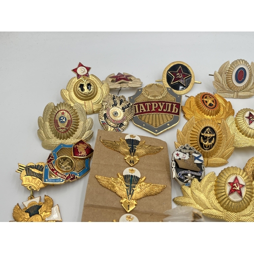 2170 - A collection of Russian badges and medals to include set of four Airbourne Troops qualification wing... 