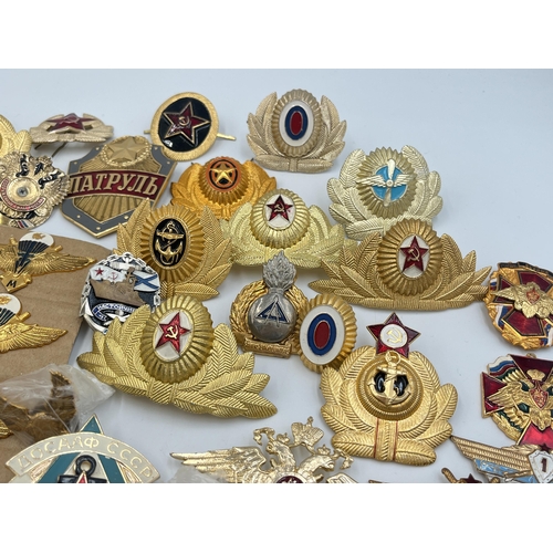 2170 - A collection of Russian badges and medals to include set of four Airbourne Troops qualification wing... 