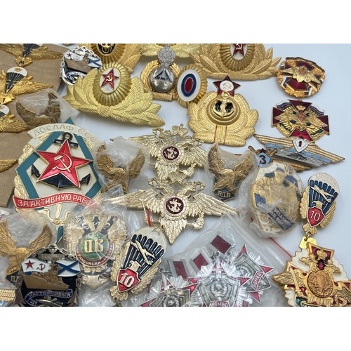 2170 - A collection of Russian badges and medals to include set of four Airbourne Troops qualification wing... 