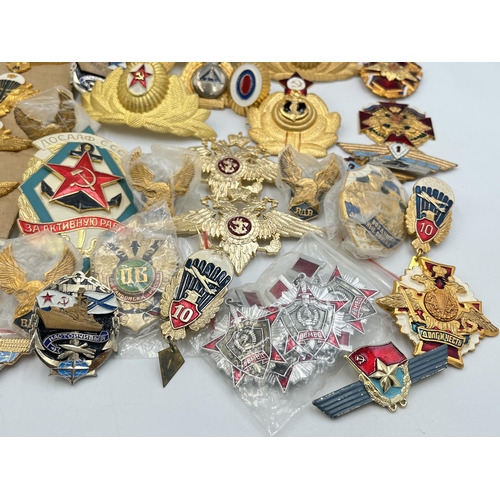 2170 - A collection of Russian badges and medals to include set of four Airbourne Troops qualification wing... 