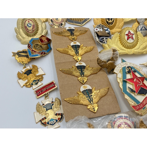 2170 - A collection of Russian badges and medals to include set of four Airbourne Troops qualification wing... 