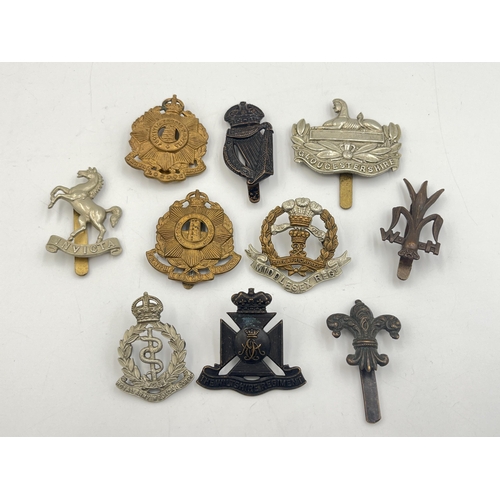 2180 - Ten military cap badges