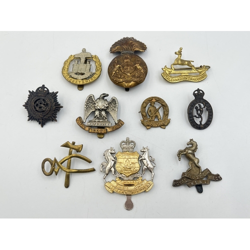 2184 - Ten military cap badges