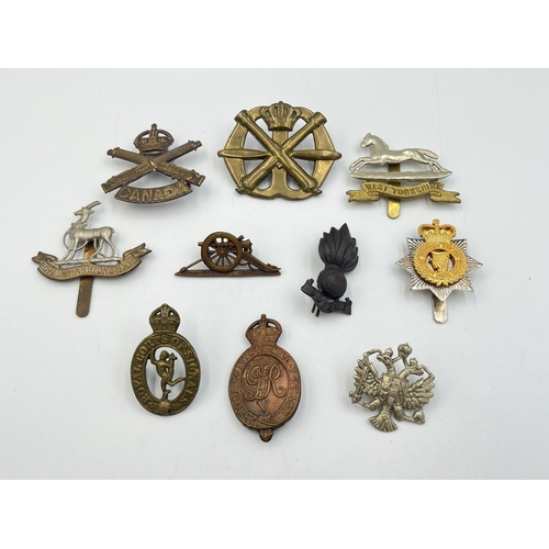 2192 - Ten military cap badges