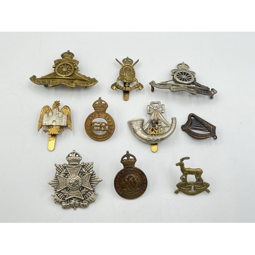 2193 - Ten military cap badges