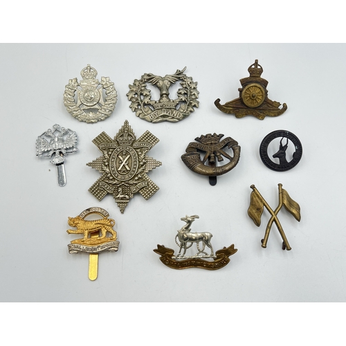 2198 - Ten military cap badges