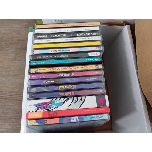 727 - Four boxes containing mixed media; CDs to include R.E.M., Genesis, Eric Clapton, Seal, Bryan Ferry &... 