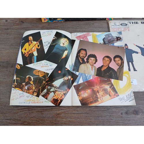 745 - Four items, one The Who 'Summer of '79' tour programme, one The Beatles 'Help!' LP vinyl record, one... 