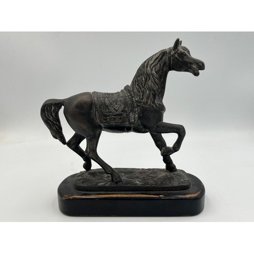 2083A - A bronzed cast metal horse figurine on ebonized plinth - approx. 17cm high