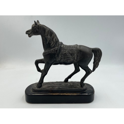 2083A - A bronzed cast metal horse figurine on ebonized plinth - approx. 17cm high