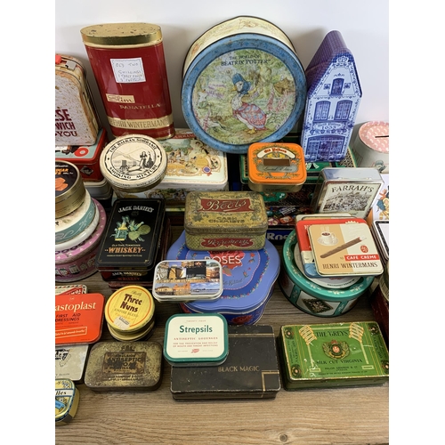 424 - A collection of vintage tins to include Senior Service cigarette, Black Magic chocolate, Emulsion an... 