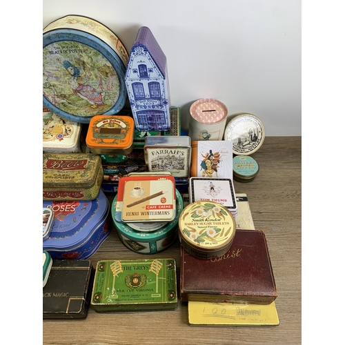 424 - A collection of vintage tins to include Senior Service cigarette, Black Magic chocolate, Emulsion an... 