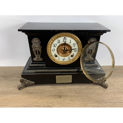 574 - An early 20th century black painted slate effect chiming mantel clock with Art Nouveau copper panell... 