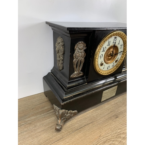 574 - An early 20th century black painted slate effect chiming mantel clock with Art Nouveau copper panell... 