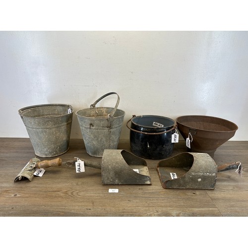 413 - A collection of metalware to include galvanized buckets, galvanized feed scoops, black and white ena... 