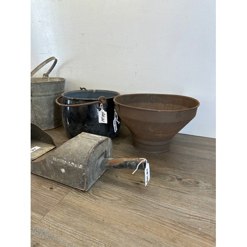 413 - A collection of metalware to include galvanized buckets, galvanized feed scoops, black and white ena... 