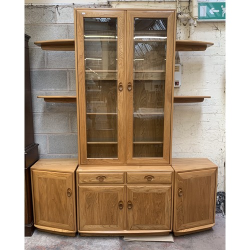 18 - An Ercol Windsor blonde elm display unit - approx. 214cm high x 181cm wide x 45cm deep