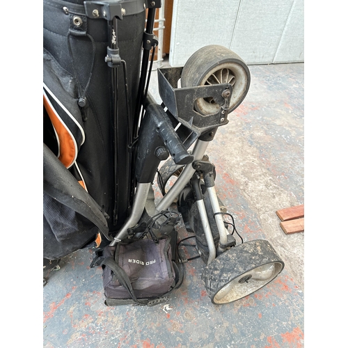 1026 - Three items, one Pro Rider electric golf trolley and two golf bags containing Dunlop clubs