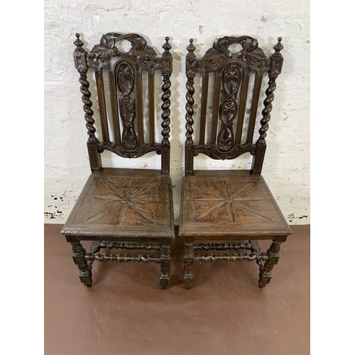 13 - Two Victorian carved oak barley twist dining chairs to include one bearing label 'J. Hunter & Co. Ma... 