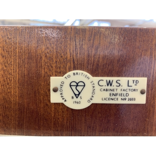 29 - A 1960s C.W.S. Ltd. walnut double wardrobe