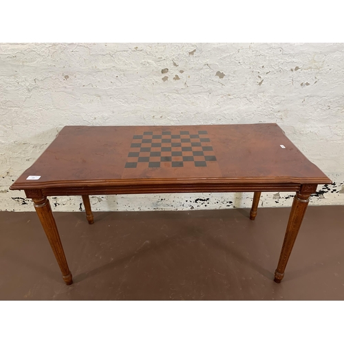 33 - A 19th century style burr walnut effect games coffee table - approx. 55cm high x 50cm wide x 100cm l... 