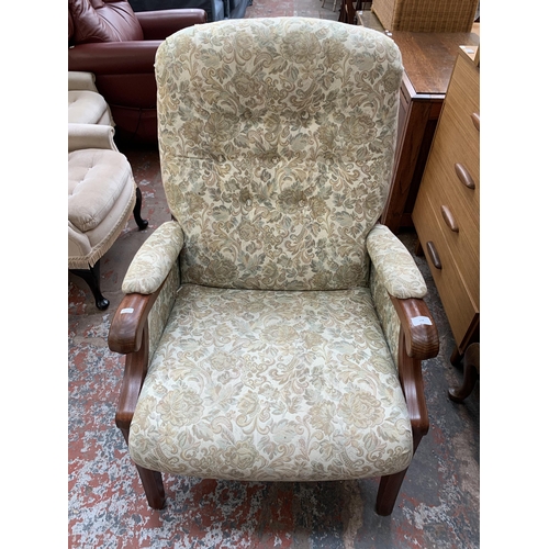 48 - A late 20th century elm and floral fabric upholstered armchair