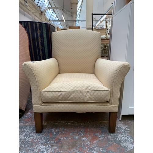 49 - A mid 20th century fabric upholstered armchair