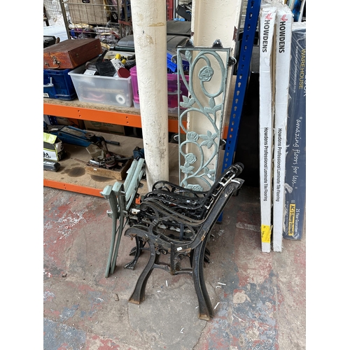 1032 - Nine items, eight cast iron bench ends and one cast iron bench back