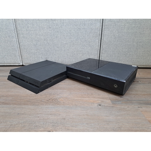 658 - Two consoles, one Sony PlayStation 4 CUH-1216B and one Microsoft Xbox One 1540 with three controller... 