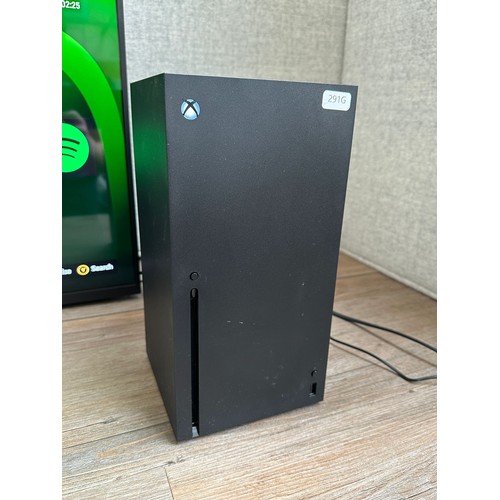 663 - A Microsoft Xbox Series X console (disc version) with power supply (TV in photographs is not include... 