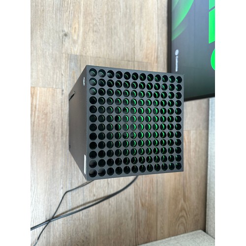 663 - A Microsoft Xbox Series X console (disc version) with power supply (TV in photographs is not include... 