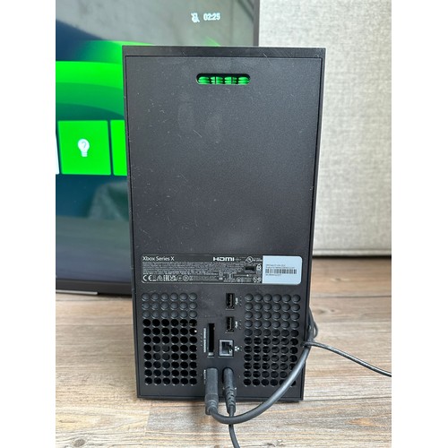 663 - A Microsoft Xbox Series X console (disc version) with power supply (TV in photographs is not include... 