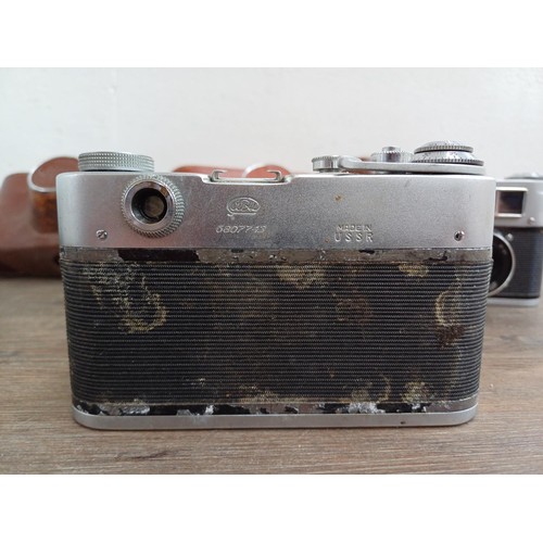 708 - Six Eastern European 35mm cameras, three cased FED screwmount rangefinder, FED 3b  fitted with Indus... 