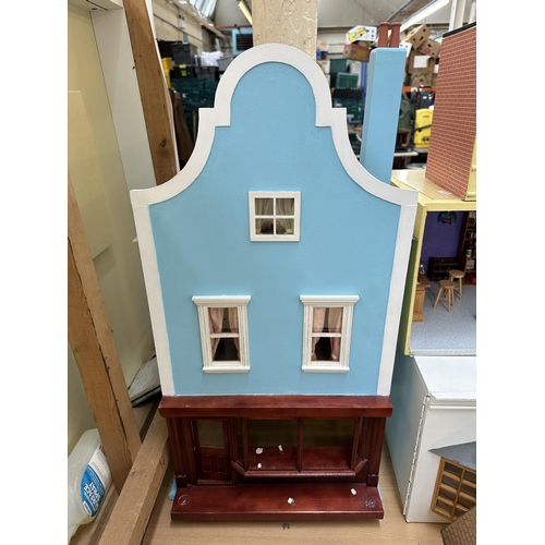 534 - A quantity of handmade and painted wooden doll's houses and accessories to include miniature bar, su... 