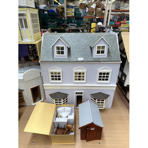 535 - A handmade wooden and hand painted Georgian style three storey doll's house - approx. 66cm high x 59... 