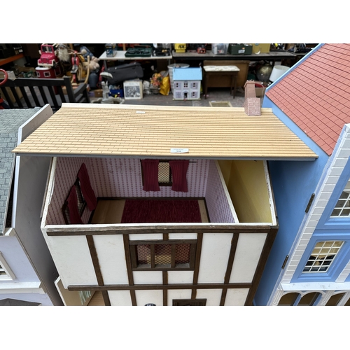 536 - A handmade wooden and painted Tudor style two storey doll's house and accessories - approx. 64cm x 4... 