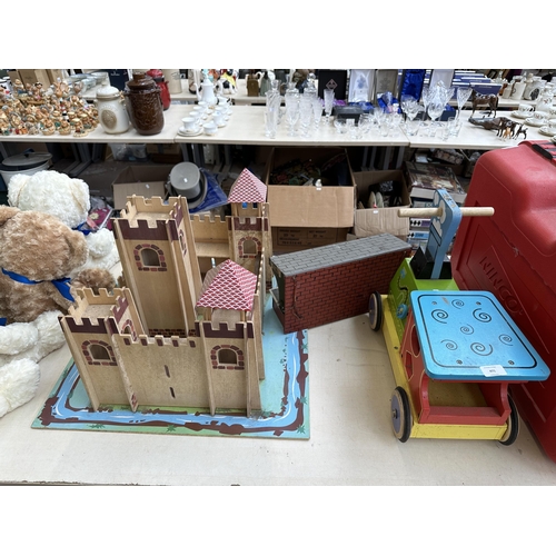 471 - Three wooden child's toys, castle and moat, railway station platform and Bigjigs Loco push along veh... 