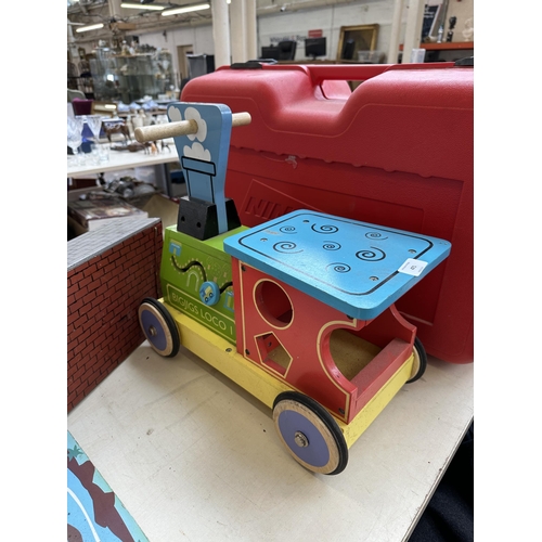 471 - Three wooden child's toys, castle and moat, railway station platform and Bigjigs Loco push along veh... 